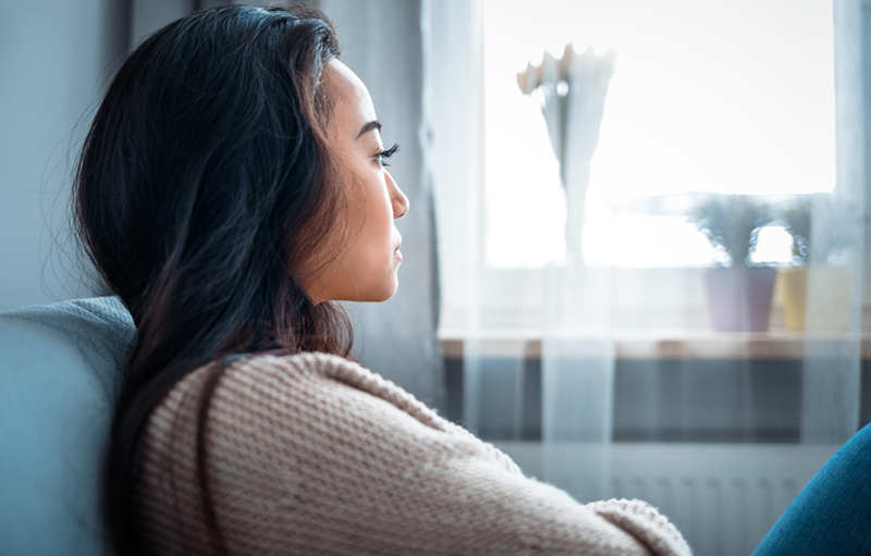 woman looking off to the side with a serious look